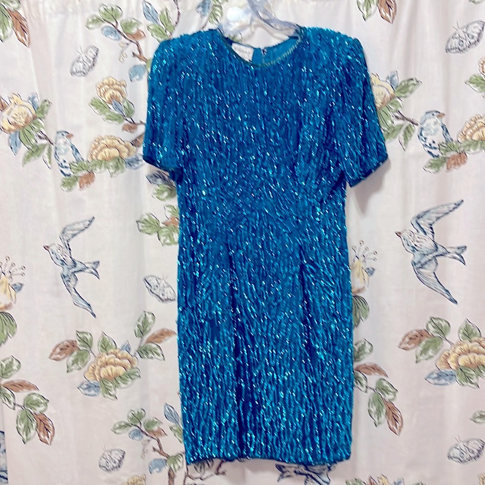 Sequined cocktail dress. Turquoise with black trim
